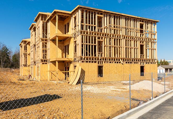 a snapshot of temporary chain link fences protecting a large construction project from unauthorized access in Manchaca